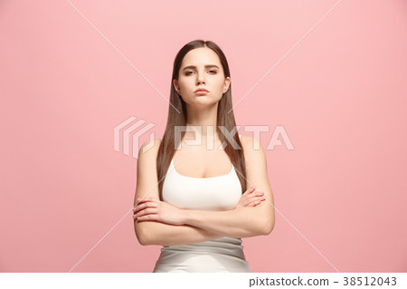 The serious business woman standing and looking at 38512043