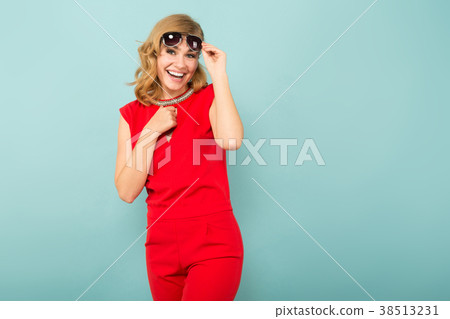 Attractive woman in red overalls and sunglasses Attractive woman in red overalls and sunglasses 38513231