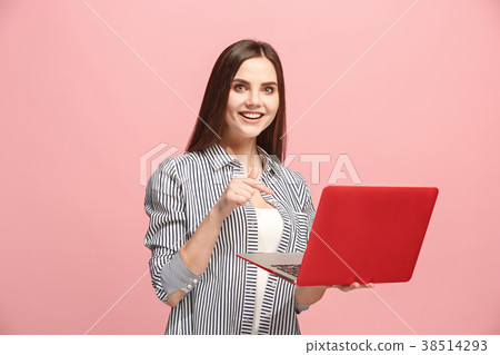 Businesswoman with laptop on pink studio Businesswoman with laptop on pink studio 38514293