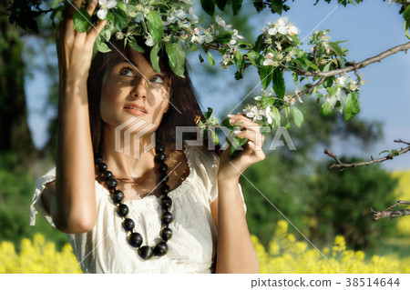 Young woman in the yellow rape field Young woman in the yellow rape field 38514644