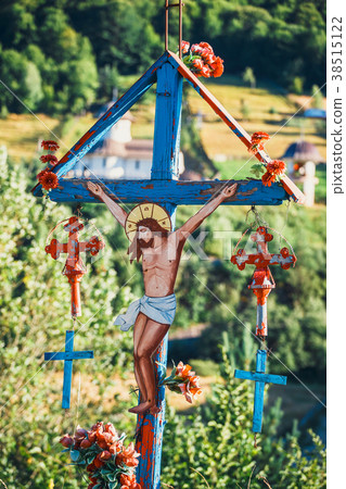 Solitary traditional cross symbol in the mountains Solitary traditional cross symbol in the mountains 38515122