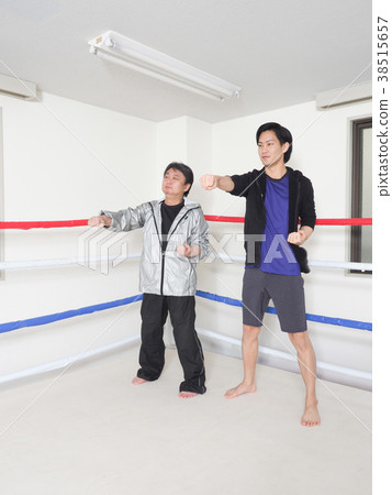Gym trainer and men Gym trainer and men 38515657