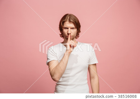 The young man whispering a secret behind her hand 38516008
