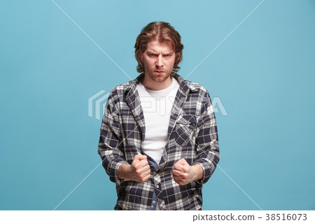 Portrait of an angry man looking at camera Portrait of an angry man looking at camera 38516073