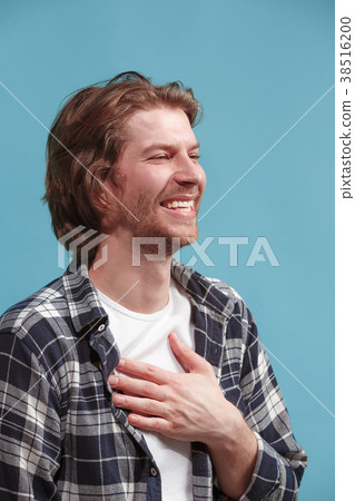 The happy businessman standing and smiling against 38516200