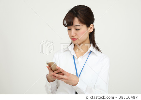 OL who is troubled to see a smartphone OL who is troubled to see a smartphone 38516487