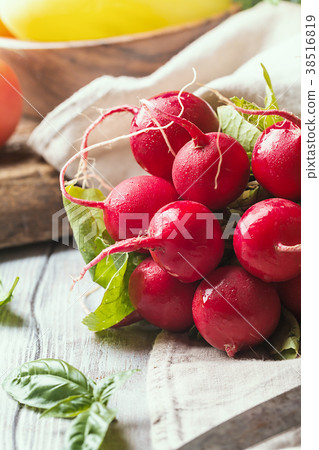 Bunch of fresh radish on dark boards, closeup 38516819