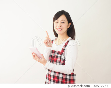 Annoyed woman holding a pink calculator 38517265