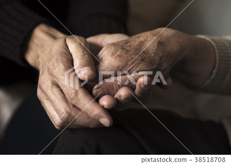 young man holding the hand of an old woman young man holding the hand of an old woman 38518708