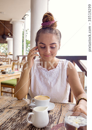 Woman talking on smartphone Woman talking on smartphone 38519299