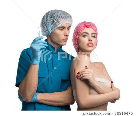 Plastic surgeon shot with his beautiful patient Plastic surgeon shot with his beautiful patient 38519470