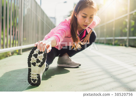 asian woman doing training workout in morning. 38520756