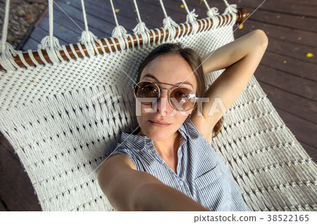 Woman laying in hammock pov Vacation selfie Woman laying in hammock pov Vacation selfie 38522165