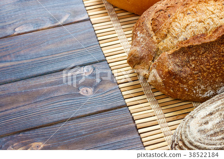 assortment of baked bread on wood table. top view 38522184