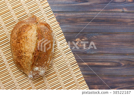 Fresh bread on wooden table. Top view Fresh bread on wooden table. Top view 38522187