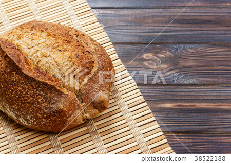Fresh bread on wooden table. Top view Fresh bread on wooden table. Top view 38522188