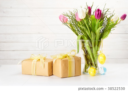 Still life with tulips, gift boxes and eggs foor 38522530
