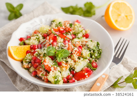 Tabbouleh salad with tomato, cucumber, couscous 38524161