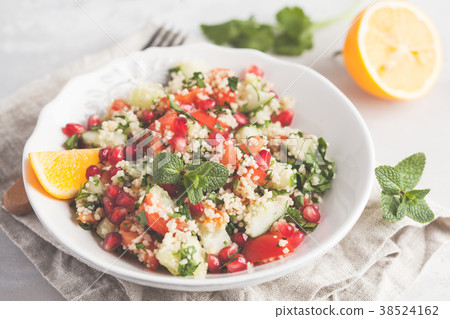 Tabbouleh salad with tomato, cucumber, couscous Tabbouleh salad with tomato, cucumber, couscous 38524162