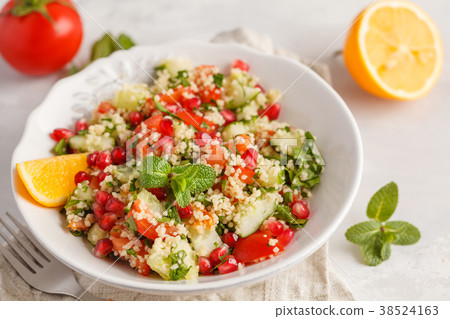 Tabbouleh salad with tomato, cucumber, couscous 38524163