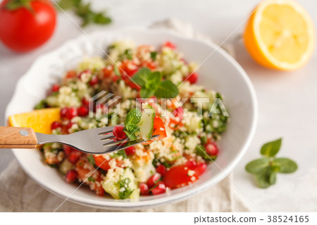 Tabbouleh salad with tomato, cucumber, couscous 38524165