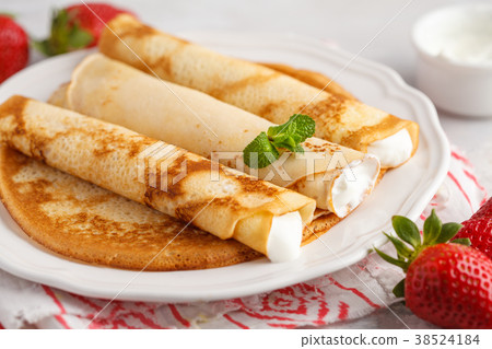 Thin hot pancakes with cottage cheese 38524184