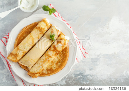 Thin hot pancakes with cottage cheese, copy space Thin hot pancakes with cottage cheese, copy space 38524186