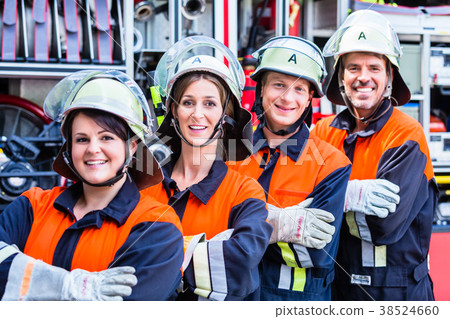 Four fire fighters doing thumbs up 38524660