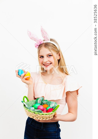 Teenage girl holding Easter eggs 38525636