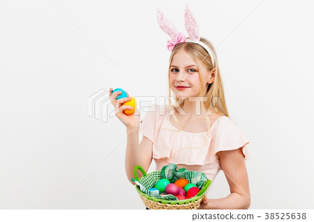 Teenage girl holding Easter eggs 38525638