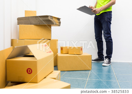 Young man as SME start up own business with box. Young man as SME start up own business with box. 38525833