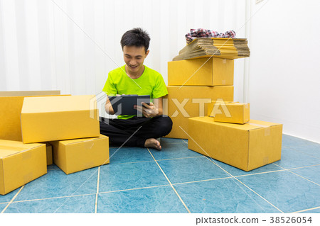 Young man as SME start up own business with box. Young man as SME start up own business with box. 38526054