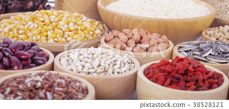 Cereal grains , seeds, beans on wooden background 38528121