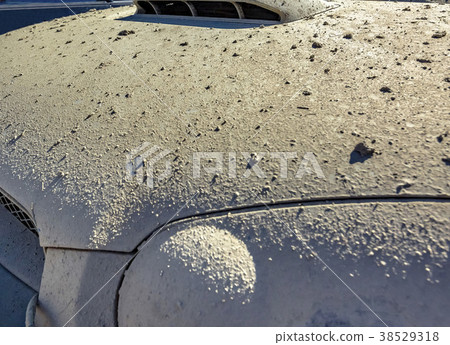 Close-up dry muddy hood of an offroading vehicle Close-up dry muddy hood of an offroading vehicle 38529318