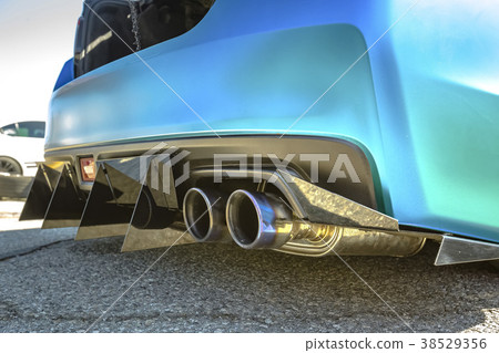 Dual exhaust pipes on a custom car with spikes 38529356
