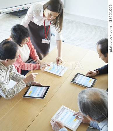 Senior attending English conversation class Senior attending English conversation class 38531096