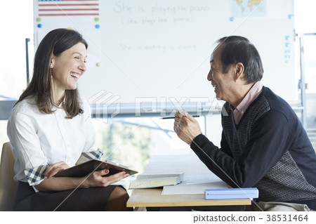 Senior attending English conversation class Senior attending English conversation class 38531464