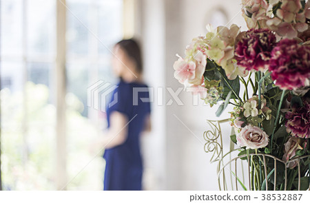 rose decoration home and blur woman standing window 38532887