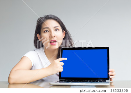 asian woman point to blank laptop screen to display asian woman point to blank laptop screen to display 38533896