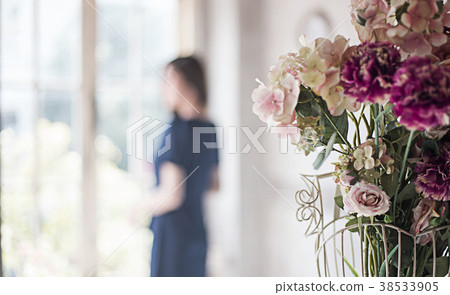rose decoration home and blur woman standing window 38533905