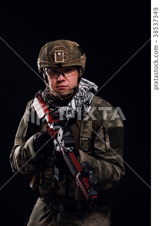 Image of military man in safety glasses with gun 38537349