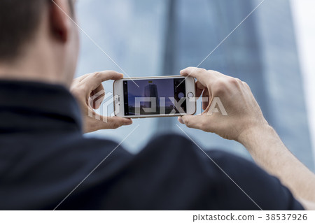 Man Photographing Skyscraper in Frankfurt Man Photographing Skyscraper in Frankfurt 38537926