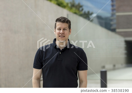 Portrait of Man Near Office Buildings 38538190