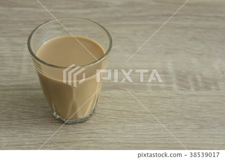 MILK COFFEE ON WOOD TABLE MILK COFFEE ON WOOD TABLE 38539017