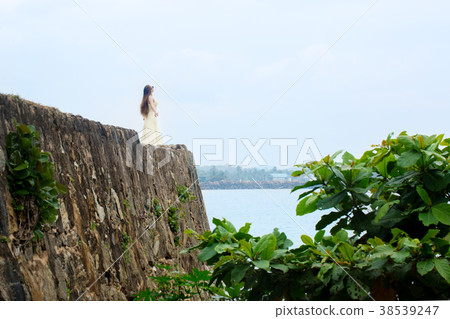 on the edge of the wall on the edge of the wall 38539247
