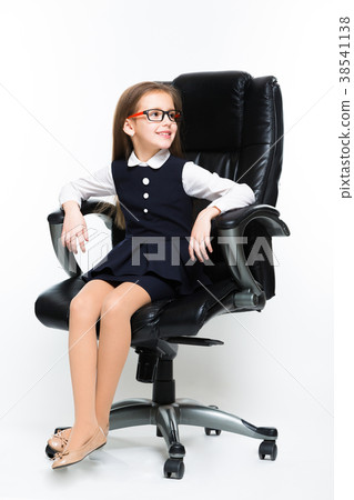 Little girl sitting in chair dressed as a 38541138