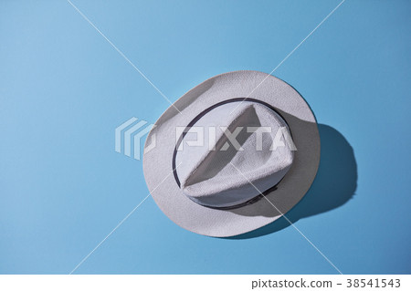gray male hat isolated on blue background 38541543