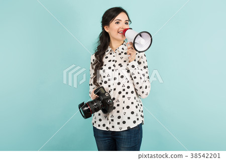 Young woman with camera and loudspeaker 38542201