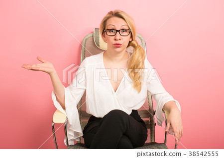Angry businesswoman shouts in chair Angry businesswoman shouts in chair 38542555