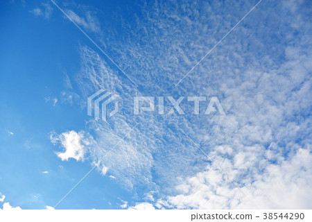 Blue sky with white cumulus clouds background Blue sky with white cumulus clouds background 38544290